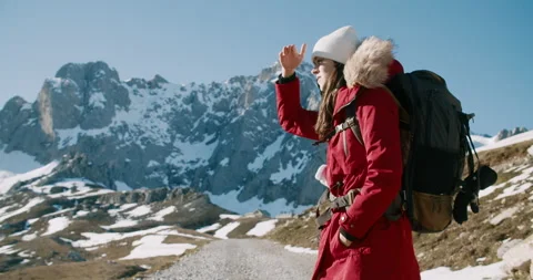 Woman hike in red jacket with backpack in winter journey mountain adventure Vidéo 211654872