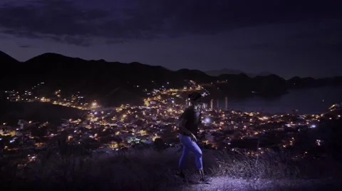 Woman hiking at dusk on mountain Stock Footage 59732758