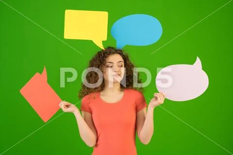 The woman hold a dialog signs on the green background Stock Photos