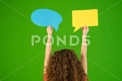 The woman hold a dialog signs on the green background Stock Photos