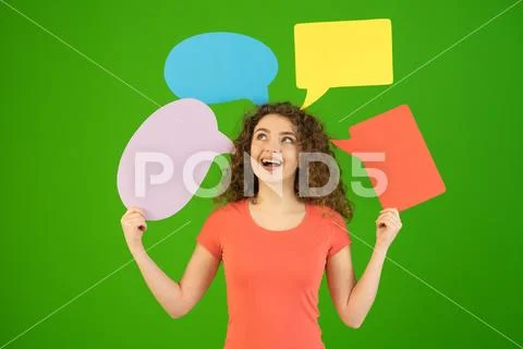 The woman hold a dialog signs on the green background Stock Photos
