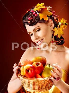 Woman holding autumn basket. Stock Photos