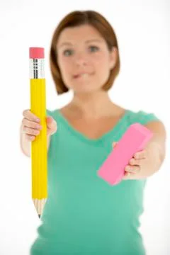 Woman Holding Big Pencil And Eraser Stock Photos