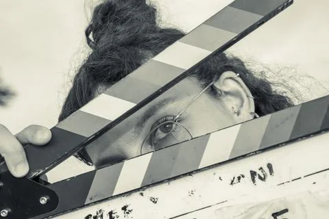 Woman holding a clapper Stock Photos