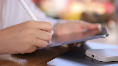 Woman is holding a computer mouse with her right hand Stock Footage 313783012