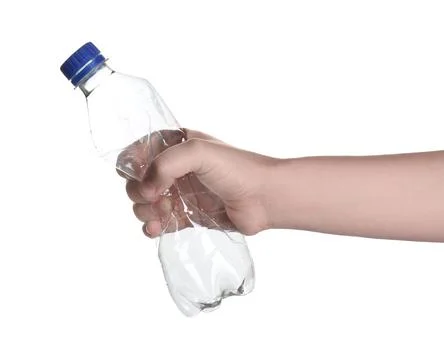 Woman holding crumpled bottle on white background, closeup. Plastic recycling Stock Photos