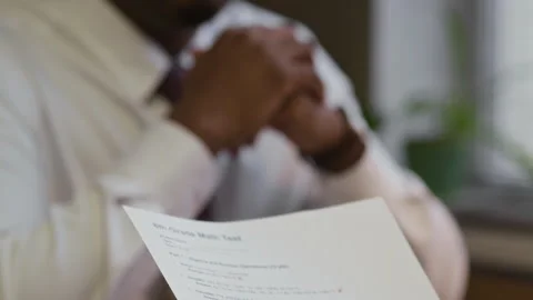 Woman Holding Failed Math Test while Talking to Principal in Office Stock Footage 322577140