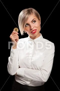Woman holding physical bitcoin cryptocurrency coins in her hands Stock Photos