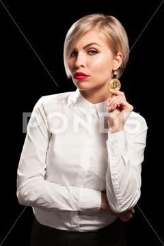 Woman holding physical bitcoin cryptocurrency coins in her hands Stock Photos
