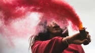 Woman Holding Red Smoke On White Background Cinemagraph Stock Footage