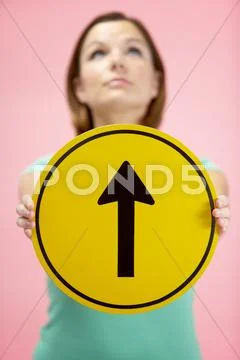Woman Holding Road Traffic Sign Stock Photos