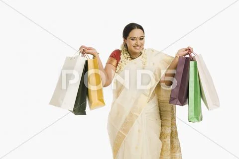 Woman holding shopping bags Stock Photos