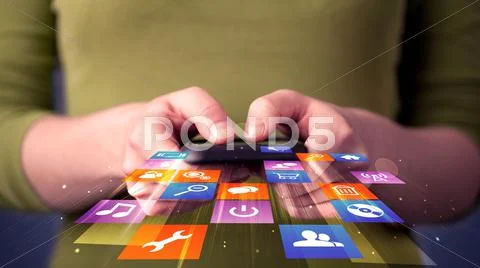 Woman holding smart phone with colorful application icons Stock Photos