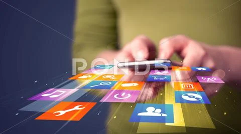 Woman holding smart phone with colorful application icons Stock Photos