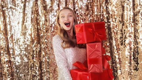 Woman holding stack of  red wrapped gift boxes Stock Footage 167218760