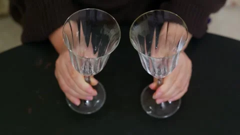Woman Holding Two Empty Wine Glasses Stock Footage 332450165