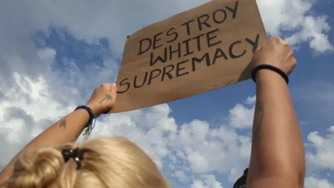 Woman Holds handmade sign that says Destroy White Supremacy at a BLM Protest Stock Footage
