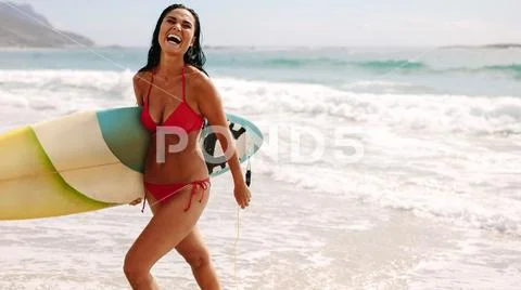 Woman on holiday enjoying surfing Stock Photos