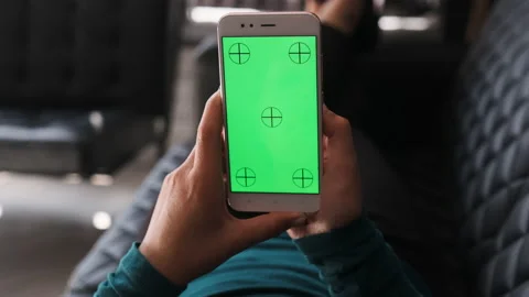 Woman at Home Lying on a Couch using Smartphone with Green Mock-up Screen. Stock Footage 136650894