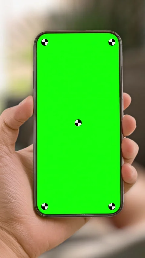 Woman at home lying on couch using smartphone with green mock up screen chroma Stock Footage 306170107