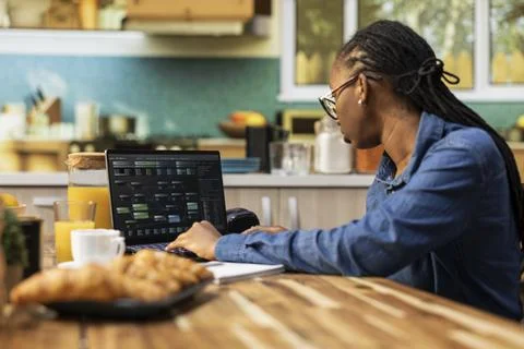 Woman at home, software developer, writing code, and debugging applications Foto stock