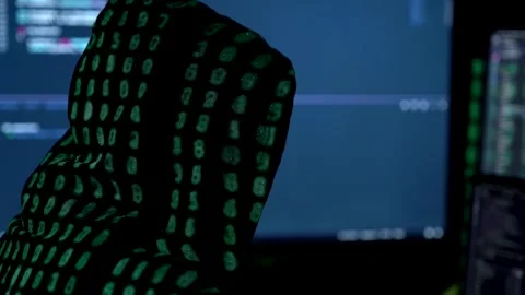 Woman in hood is hacking password. Programmer software developer is writing c Stock Footage 149298811