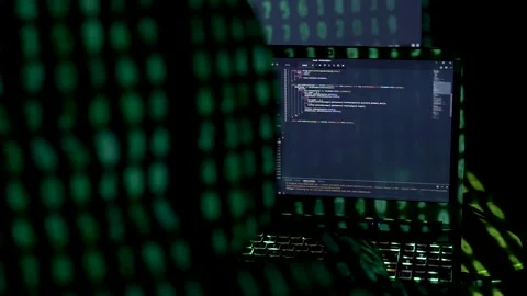 Woman in hood is hacking password. Programmer software developer is writing c Stock Footage 149298822