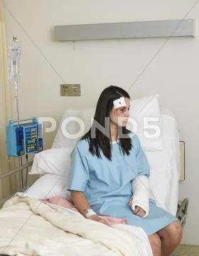 Woman in Hospital Room with Injuries Stock Photos
