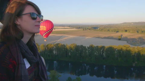Woman in hot air balloon smiles Stock Footage 59791167