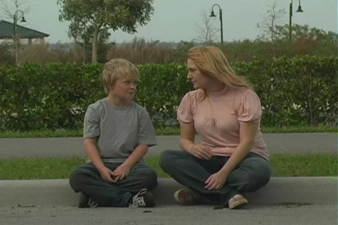 Woman Hugs Her Child at Roadside Stock Footage