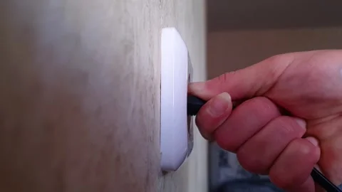 Woman includes an electrical appliance, plug socket,appliances, electricity Stock Footage 313614564