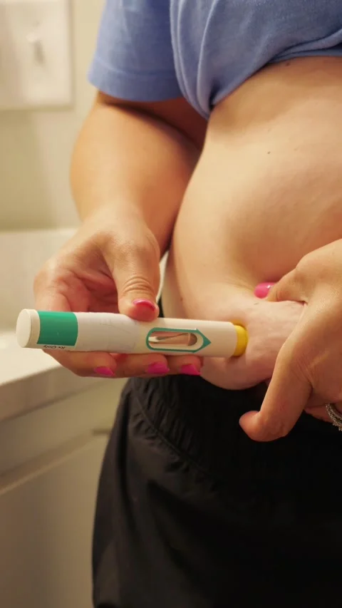 Woman Injecting Self-Administered Auto-Injector Stock Footage 342363814