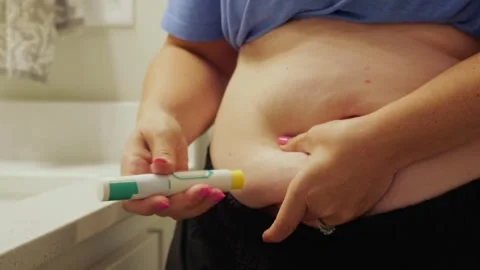 Woman Injecting Self-Administered Auto-Injector Stock Footage 342363818