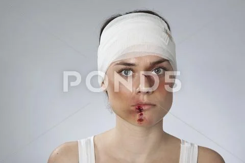 A woman with injuries and a bandhead Stock Photos