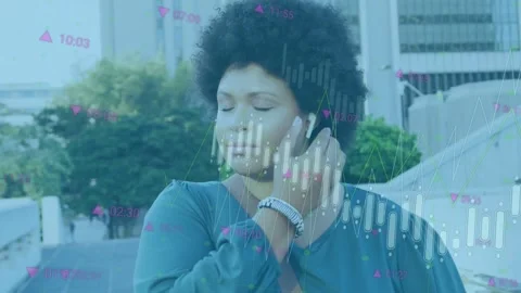 Woman inserting earbud and tapping phone on walkway checking market data as Stock Footage 335317358