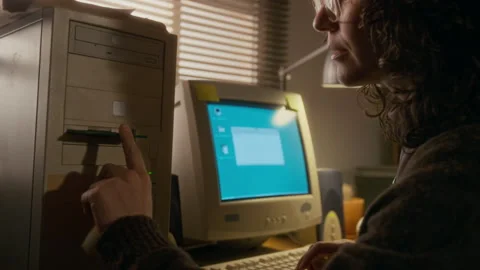 Woman Inserting Floppy Disk into Old Computer to Save Document File Stock Footage 327238466