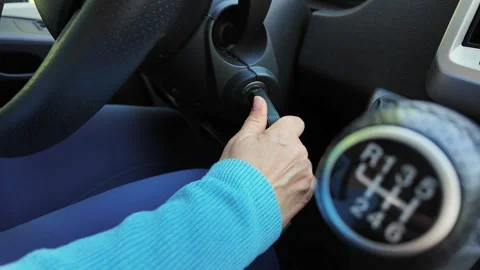 Woman Inserting Key into Ignition of Camper Van. Starting Motorhome Engine. Stock Footage 336560493