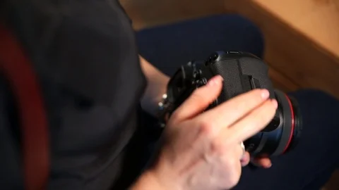 Woman inserts memory card to the camera Stock-Footage 106796166