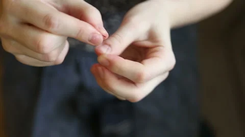 The woman inserts the thread through the needle Stock Footage 57261042