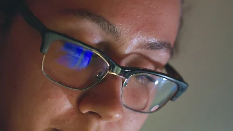 Woman intensely coding under deadline pressure. Dedicated woman working late Stock Footage 335173829