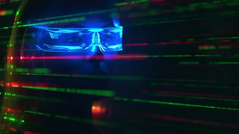 The woman in interactive glasses on a laser rays background Stock Footage 191444026