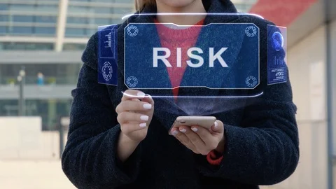 Woman interacts HUD Risk Stock Footage 123738118