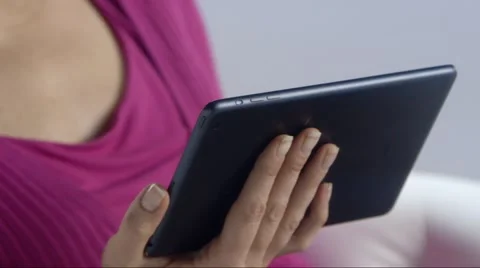 Woman interacts with tablet device Stock Footage 52966834