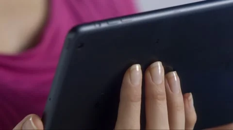 Woman interacts with tablet device Stock Footage 53232486
