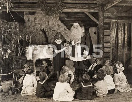 Woman introducing Santa Claus to children during Christmas Stock Photos