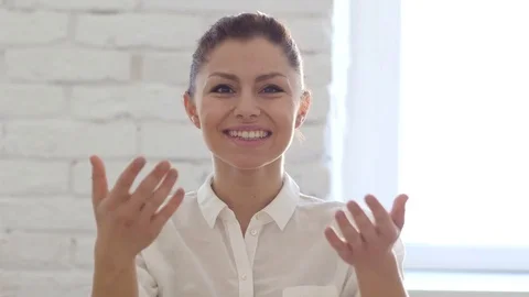 Woman Inviting Customers with Both Hands in Office Stock Footage