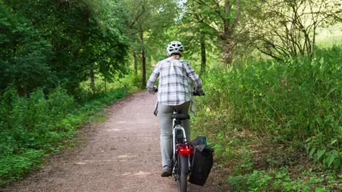 Woman Inviting Viewer To Join Electric Bicycle Ride Stock Footage 341829889