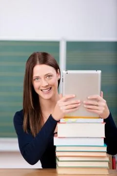 Woman with ipad and books Stock Photos