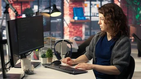 Woman IT developer using pc setup for artificial intelligence cloud computing 写真素材