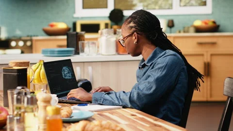 Woman IT engineer working with AI tools and laptop for data and metrics 스톡 동영상 344246559